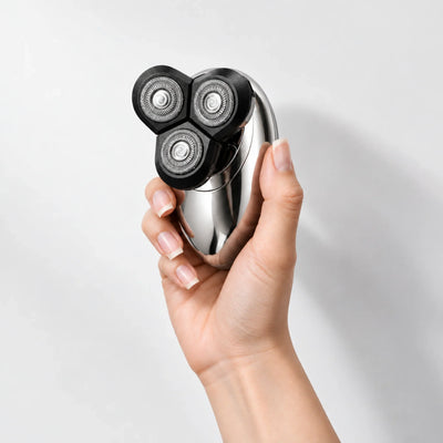 VAVAME electric face shaver held in one hand to show its compact size